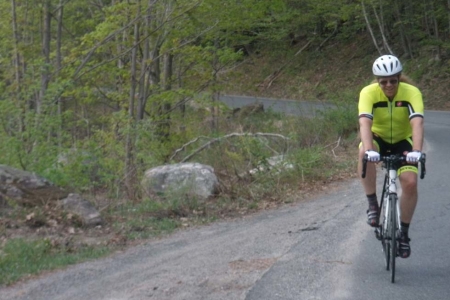 Zachary struggles up the mountain bicycling