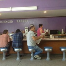 Some patrons at the counter at Richmond Bakery