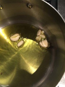 4-5 cloves in extra virgin oil on low heat